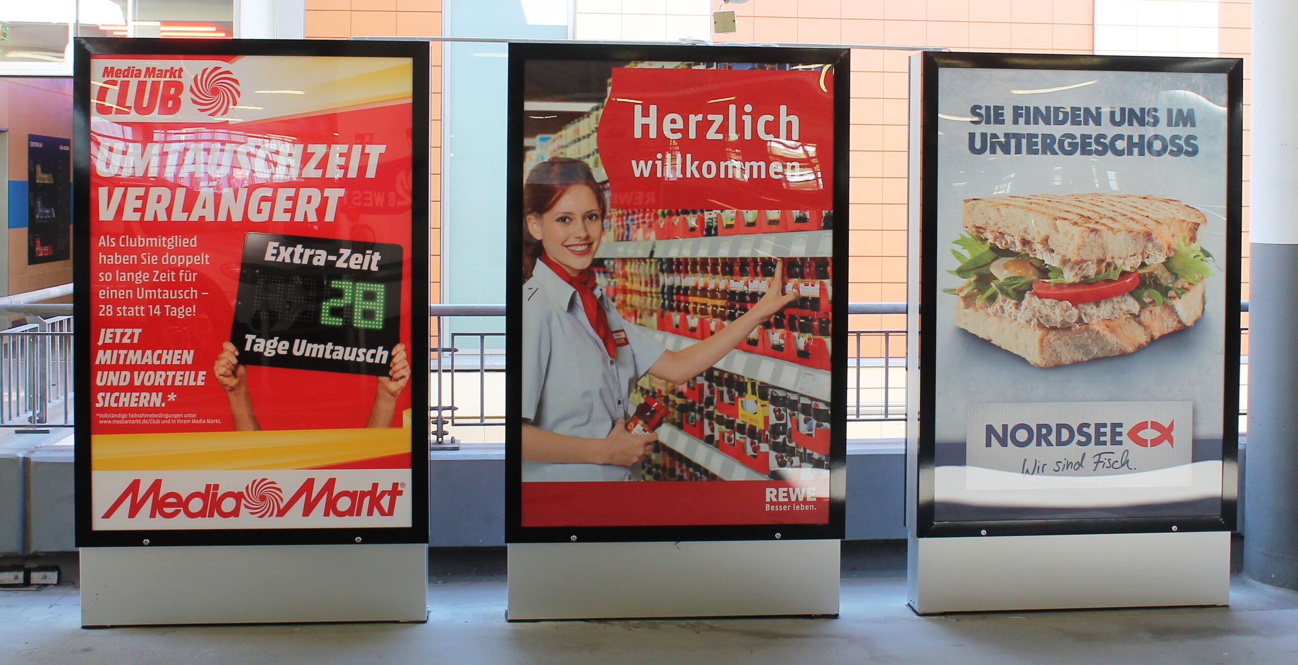 Media Markt, Rewe, Nordsee Parkhauswerbung